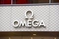 Omega watches brand logo in close-up at retail store.